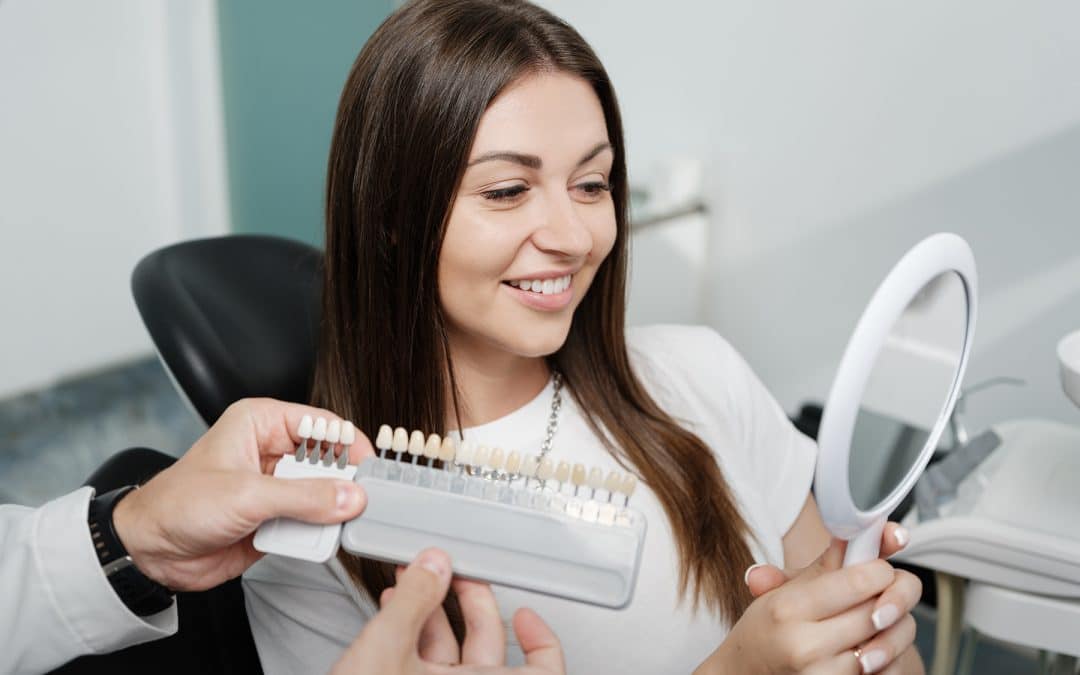 Woman getting dental veneers in Auburn Hills, MI
