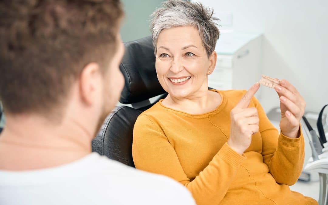 dental patient talking to Dr Joseph about the Dental Implant Process at Pristine Dental Care